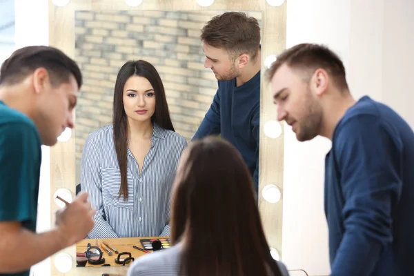 Professional makeup artist teaching trainee in salon. Apprenticeship concept — Stock Photo, Image