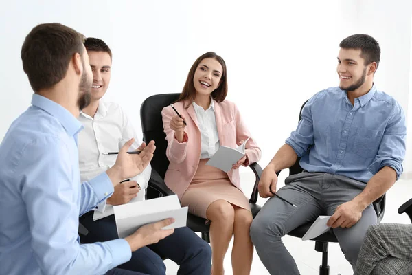 Young men putting fists together, indoors. Unity concept — Stock Photo, Image