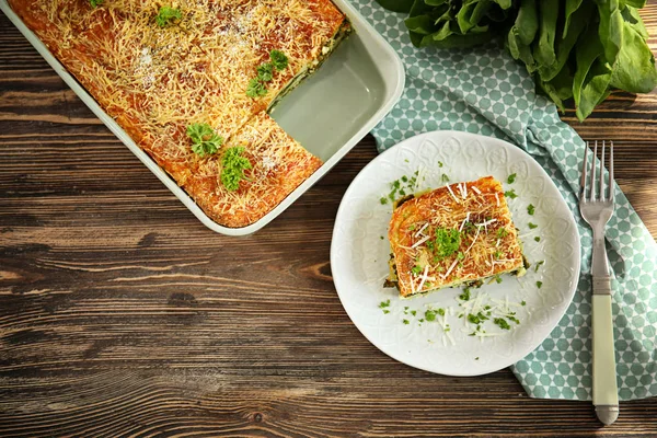 Lasagna with spinach on table — Stock Photo, Image