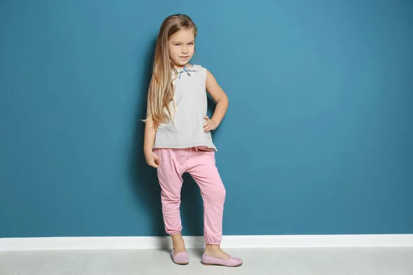 Cute little girl on color background — Stock Photo, Image