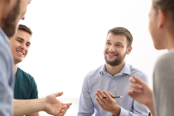 Young men putting fists together, indoors. Unity concept — Stock Photo, Image