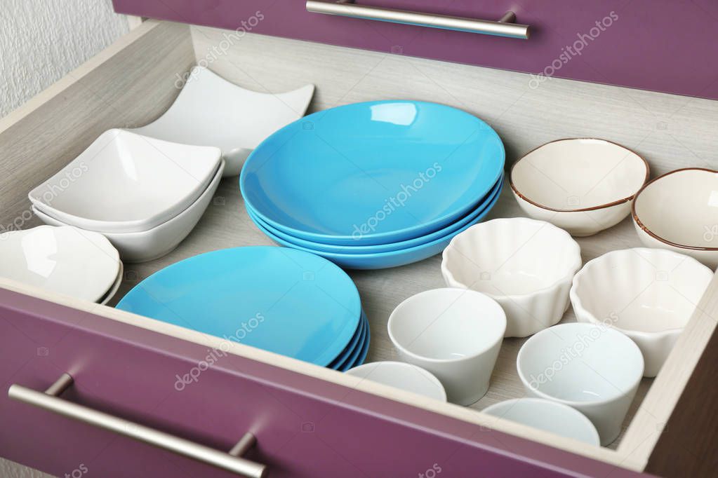 Ceramic dishware in drawer