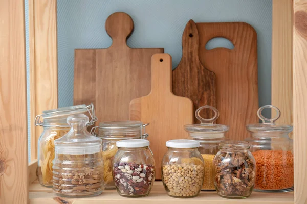 Glass Jars Different Foodstuff Cutting Boards Shelf Indoors — Stock Photo, Image