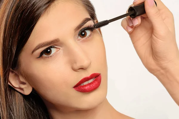 Beautician Applying Mascara Young Woman Eyelashes White Background — Stock Photo, Image