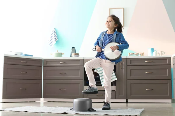 Cute Little Girl Playing Frying Pan Guitar Indoors — Stock Photo, Image