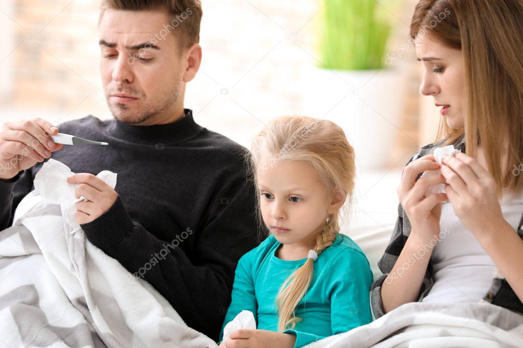 Sick family in bed at home