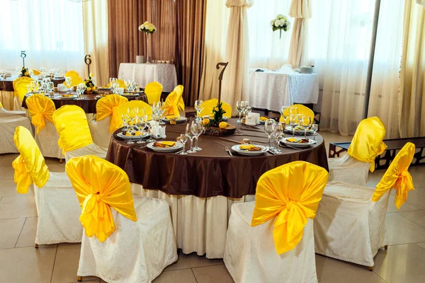 Table served for wedding banquet. Table setting. Number of guest table at wedding banquet