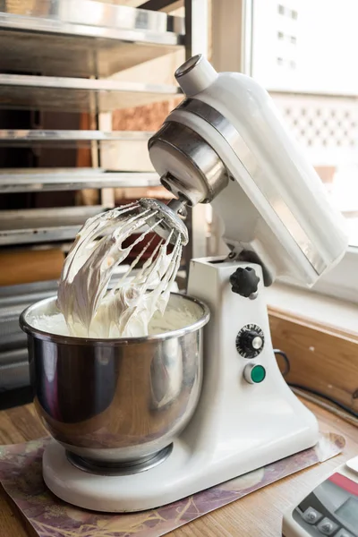 Food processor to kneading dough for cake. Manufacturing process of sweet cake in mixer