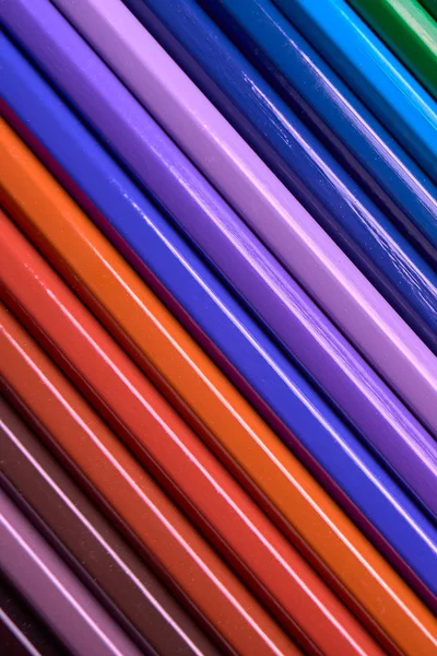 Color pencils background, close up. Set of colorful pencils, copy space. Crayons. Top view, flat lay. Back to school, college concept. Abstract background