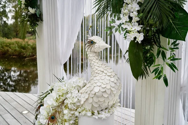 Luxury floral decor for wedding ceremony with palm leaves, orchi