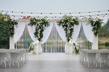 Place for wedding ceremony with wedding arch decorated with palm clipart