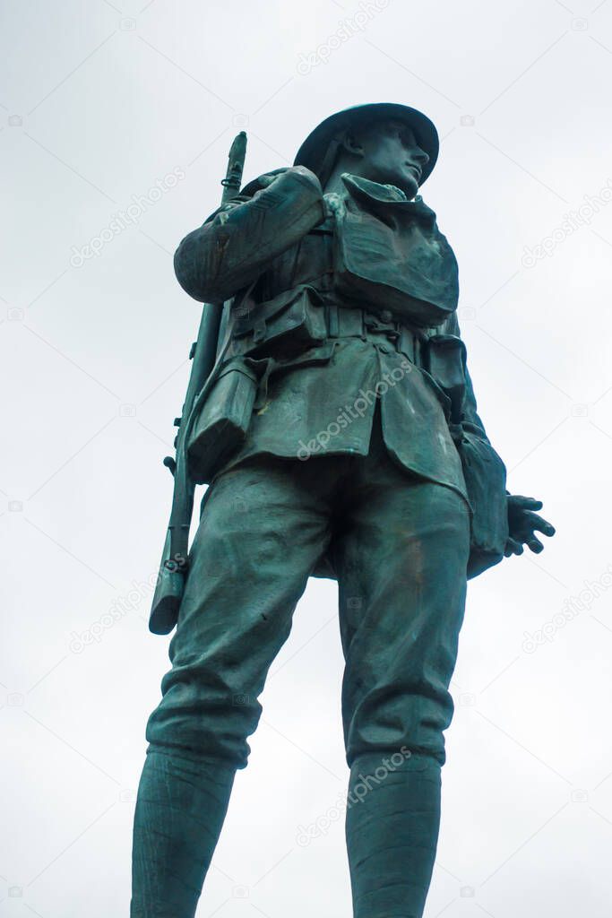 Statue of foot solider on war memorial in Kendal