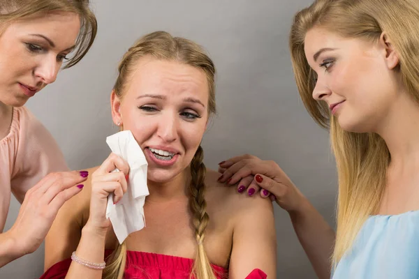 Female women comforting her woman sad friend helping her dealing with problems.