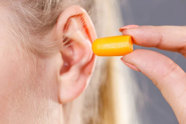 Woman Putting Ear Plugs Her Ears Getting Rid Noise Loud — Stock Photo, Image