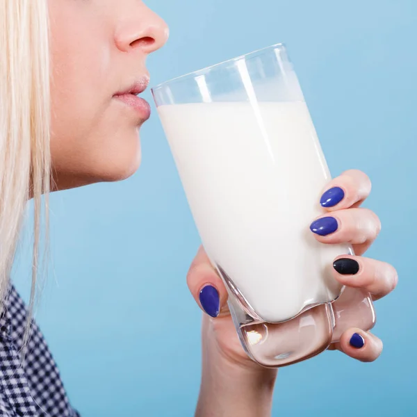 Healthy drinks, good nutrition, perfect breakfast concept. Woman drinking milk from glass