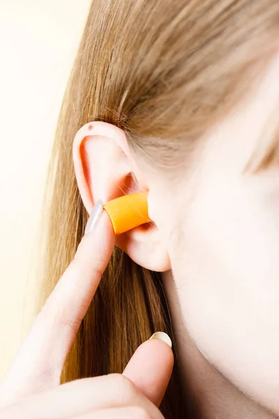 Woman Putting Ear Plugs Her Ears Getting Rid Noise Loud Stock Picture