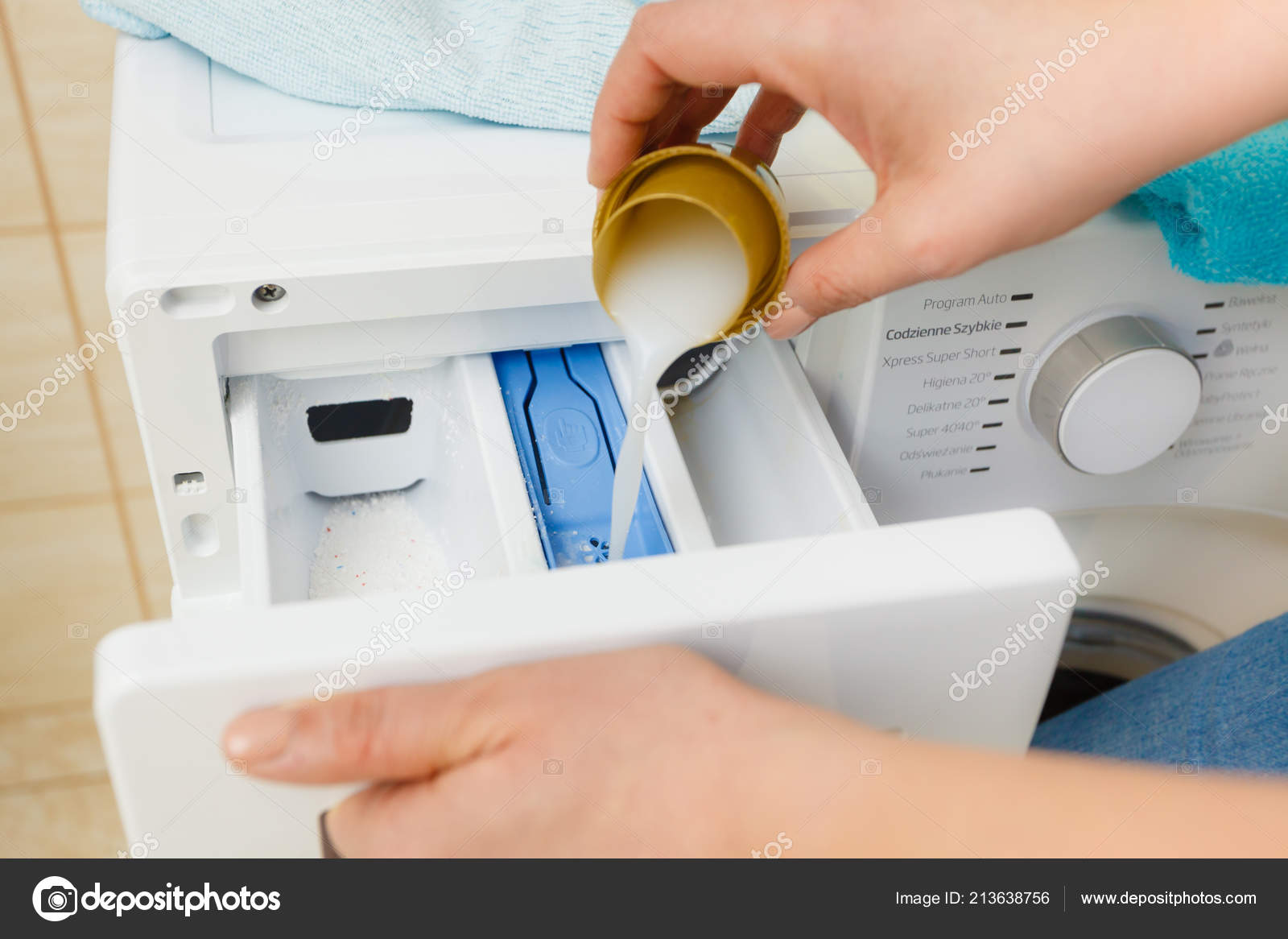 Liquid Powder Detergent Measuring Cup Pouring Machine Household Duties Clothes Stock Photo by