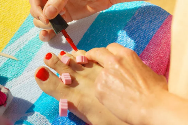 Woman Relaxing Doing Her Pedicure Red Nail Polish Beach Towel — Stock Photo, Image