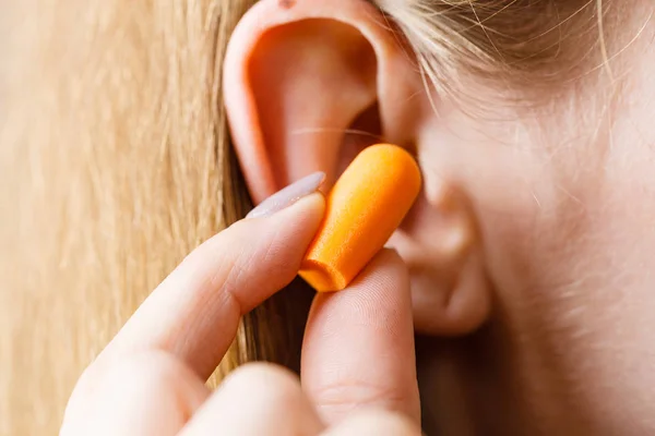 Woman Putting Ear Plugs Her Ears Getting Rid Noise Loud Royalty Free Stock Photos