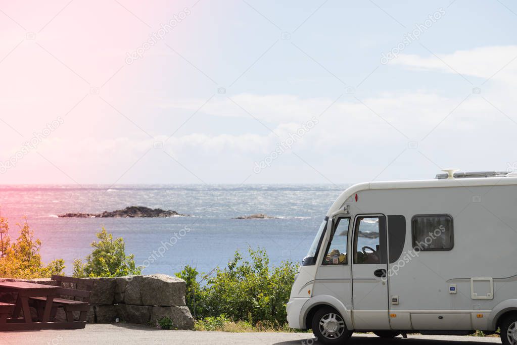 Tourism vacation and travel. Camper van and rocky coast landscape of southern Norway with an ocean view in Rogaland county Norway.
