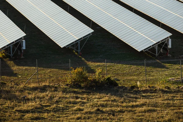 Long black dark solar panels outdoor. Ecological objects, renewable energy sources concept.