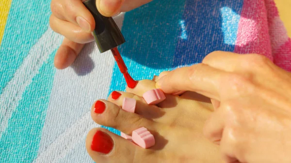 Woman Relaxing Doing Her Pedicure Red Nail Polish Beach Towel — Stock Photo, Image