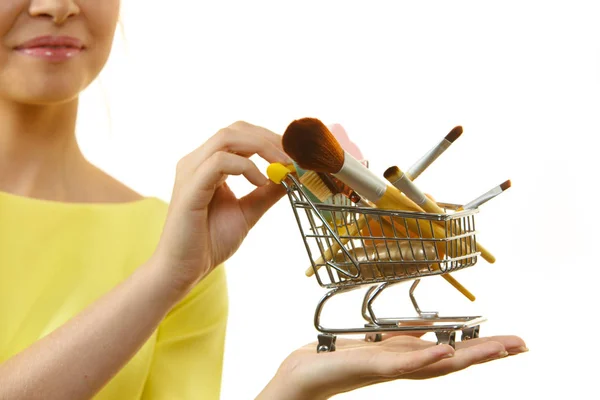 Woman Holding Shopping Cart Full Beauty Accessories Various Make Brushes — Stock Photo, Image