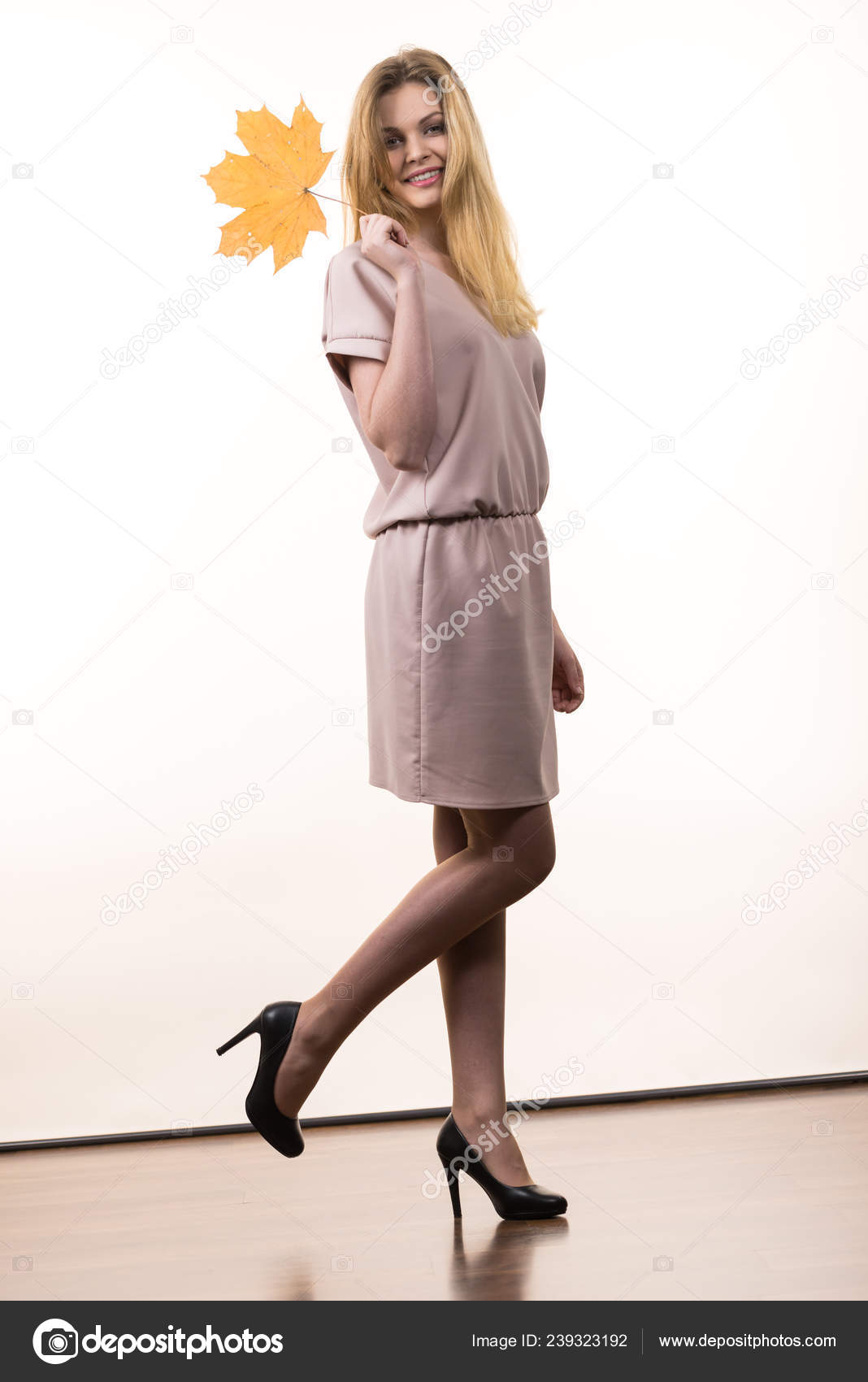 Fashionable Autumn Long Hair Blonde Girl Wearing Beige Dress High