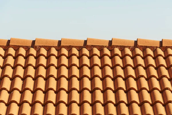 Red tiles roof texture architecture background, detail of house close up detail.