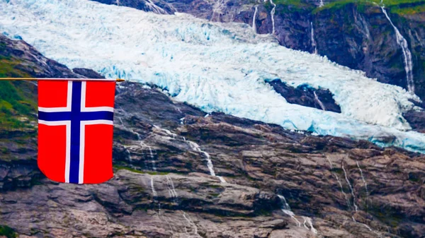 Boyabreen Glacier and norwegian flag — Stock Photo, Image