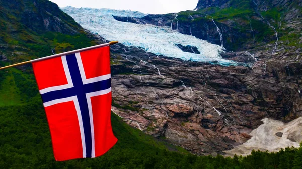 Boyabreen Glacier and norwegian flag — Stock Photo, Image