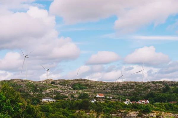wind turbines farm on coast hills