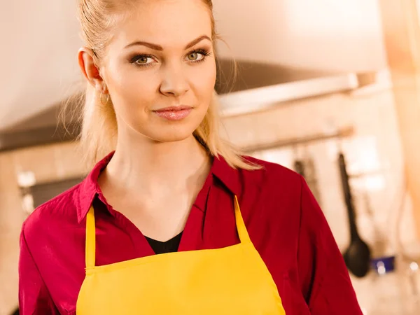 Young woman wearing apron