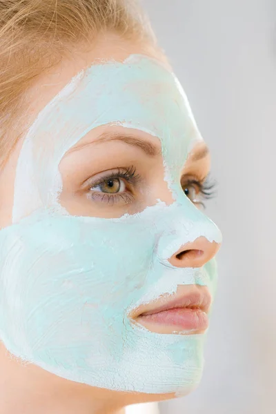 Girl with white green mud mask on face — Stock Photo, Image