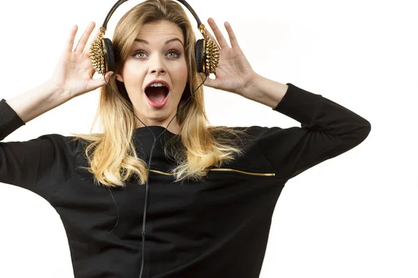 Suprised woman wearing headphones — Stock Photo, Image