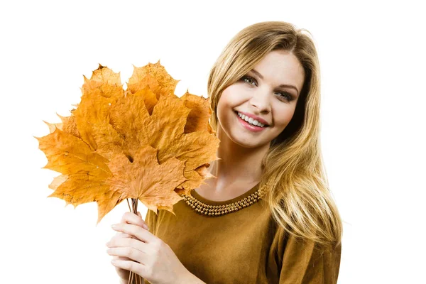 Woman holding orange autumn leaf — Stock Photo, Image