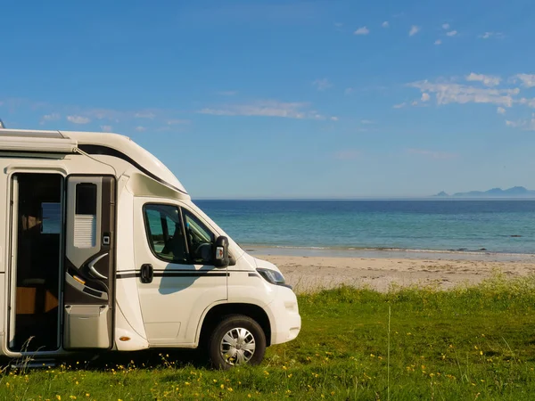 Camper van on sea shore, Lofoten Norway