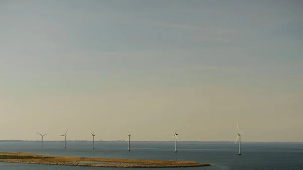 wind turbines farm on coast