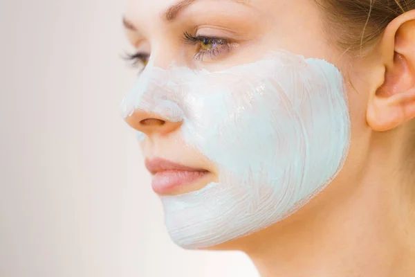 Girl with white green mud mask on face — Stock Photo, Image