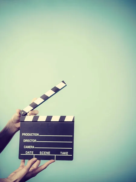 Woman holding professional film slate — Stock Photo, Image