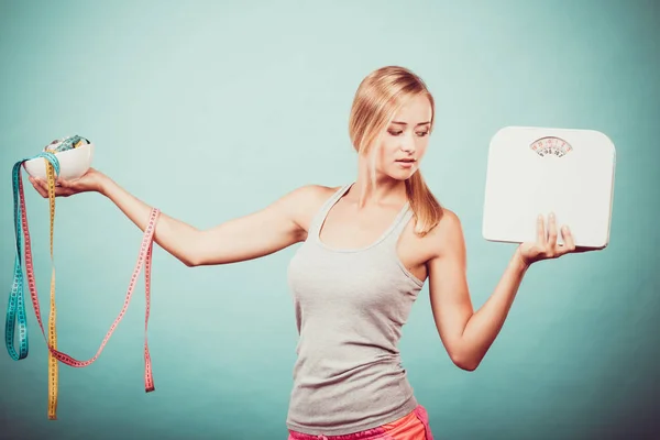 Girl with scales measuring tapes. Weight loss. — Stock Photo, Image