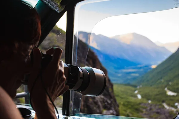 Photographer taking photo from camper car