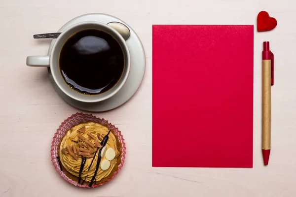 Coffee cup cupcake and red blank paper