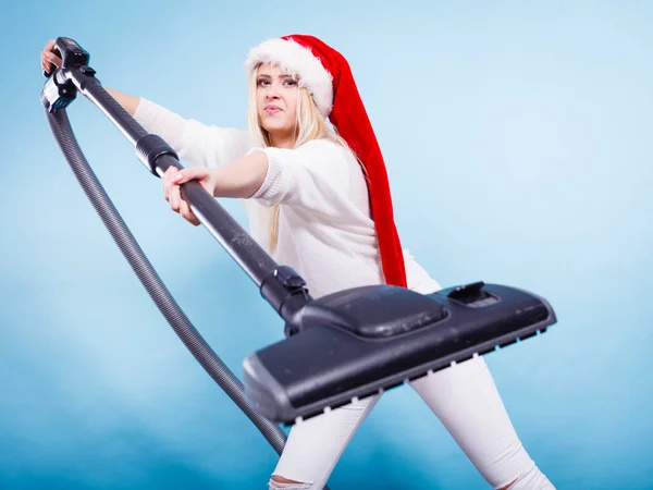 Girl in santa helper hat with vacuum cleaner — Stock Photo, Image