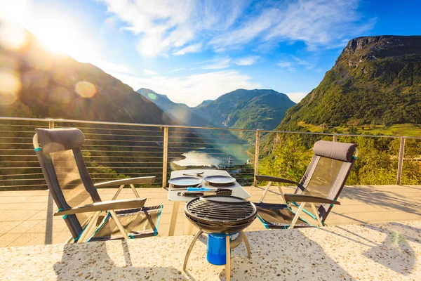 Dinner table with grill on norwegian nature