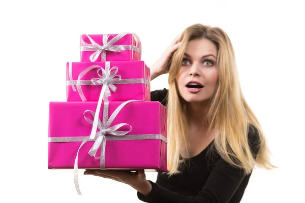 Surprised girl with pink gift boxes — Stock Photo, Image