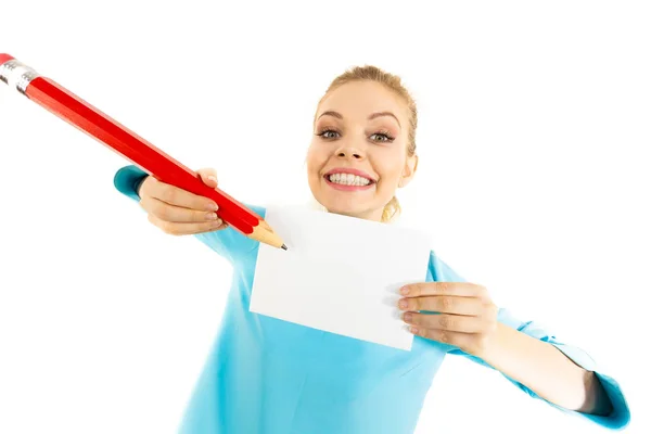 Woman with big pencil writing on paper — Stock Photo, Image