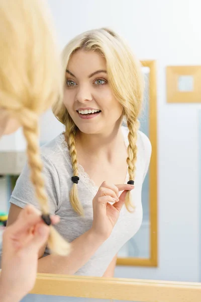 Lovely blonde woman in braids — Stock Photo, Image