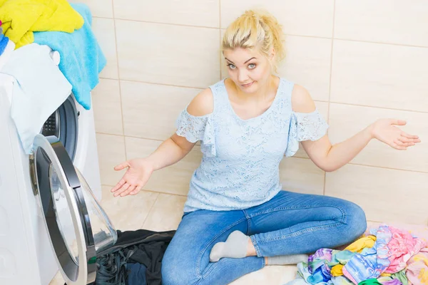 Unhappy woman having a lot of laundry — Stock Photo, Image