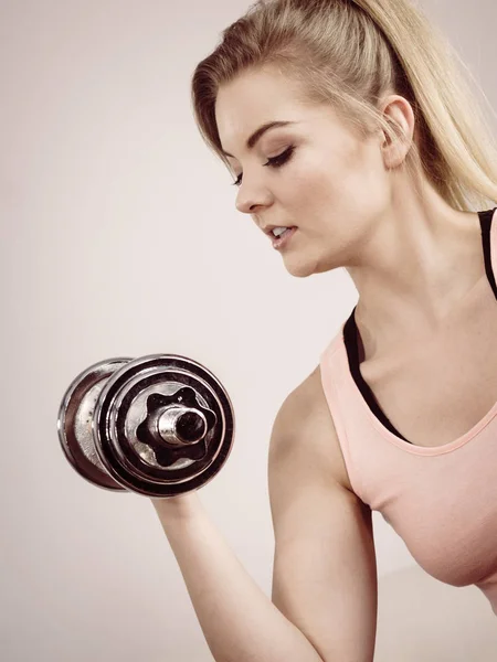 Woman working out at home with dumbbell — Stock Photo, Image